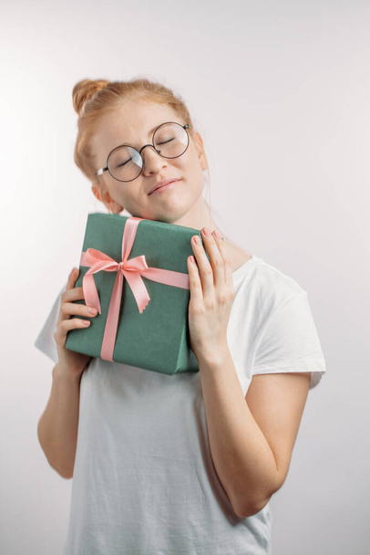 romantic ginger girl is glad at surprise. present concept - Фото, изображение