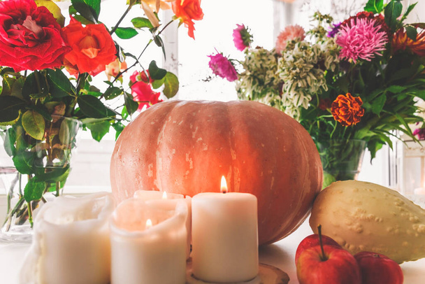 Still life with pumpkins and burning candles. Autumn background. - Fotografie, Obrázek