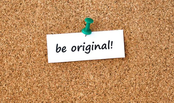 Be original. Text written on a piece of paper or note, cork board background. - Photo, Image