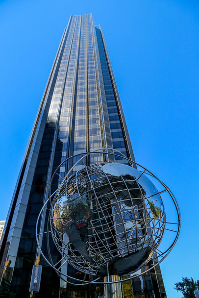 NEW YORK - JULY 30, 2017: Globe in the front of Trump International Hotel and Tower at Columbus Circle, Manhattan, New York - Фото, изображение