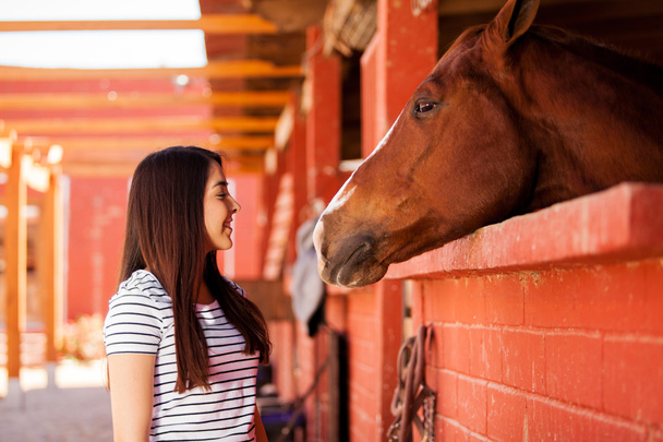 Girl enjoying the company of her horse - Photo, Image