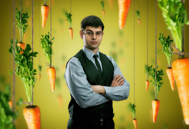 Businessman and carrots - Photo, Image
