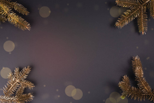 festive Christmas and New Year background with Christmas tree twigs and bokeh with copy space - Fotografie, Obrázek