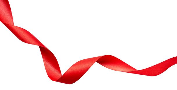 A curly red ribbon for Christmas and birthday present banner isolated against a white background. - Fotoğraf, Görsel