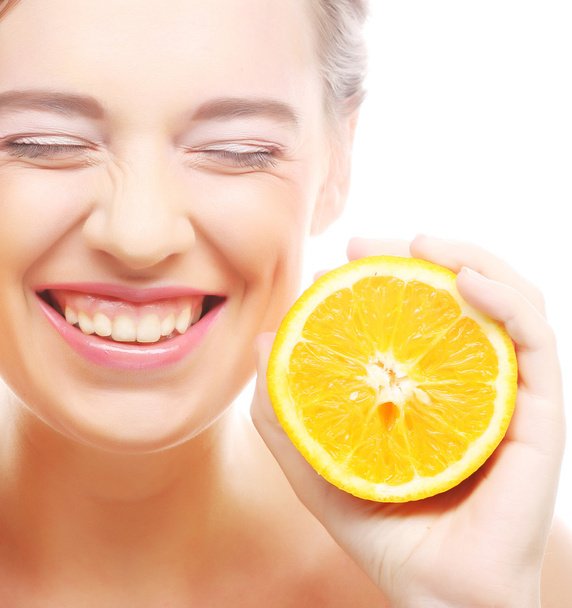 cheerful woman with oranges in her hands - Fotó, kép