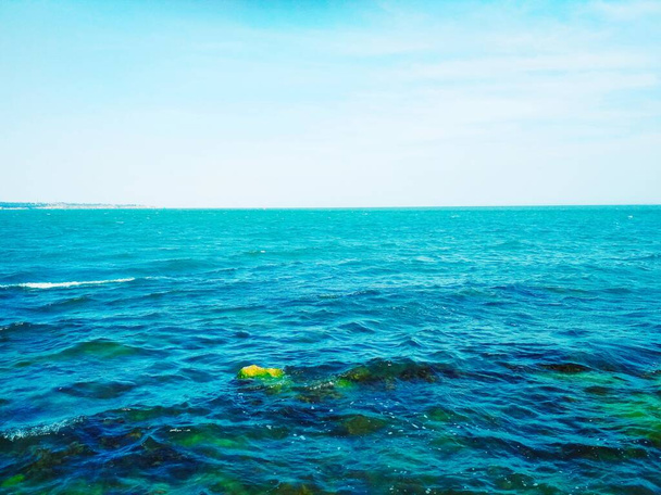 Wavy Black Sea with some underwater stones  - Photo, Image