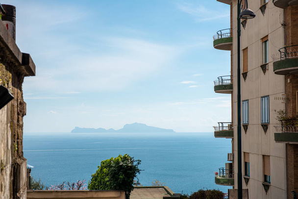An island in the Mediterranean seen from a street in Naples - Фото, изображение