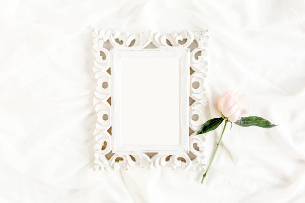Gold frame decorated of beautiful beige peonies. Flat lay, top view. Valentines background. Floral frame. Peony texture. - 写真・画像