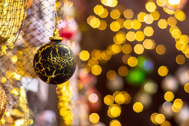 Golden brown christmas ball in grunge style. Shallow depth of field. - Foto, Imagen