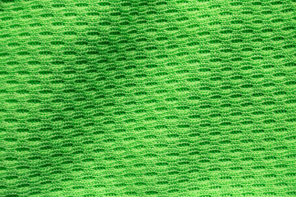 Πράσινο αθλητικό ύφασμα ένδυσης ποδόσφαιρο πουκάμισο φανέλα υφή close up - Φωτογραφία, εικόνα