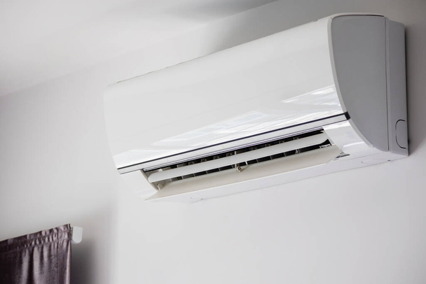 Air conditioner on white wall room interior background - Фото, зображення