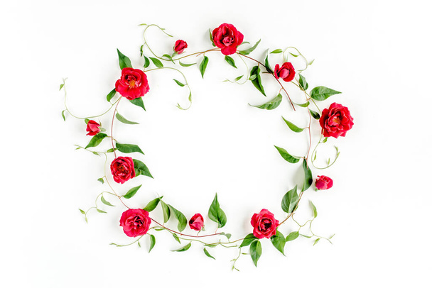 Wreath frame made of green branches, leaves and roses isolated on white background. lay flat, top view - Fotografie, Obrázek