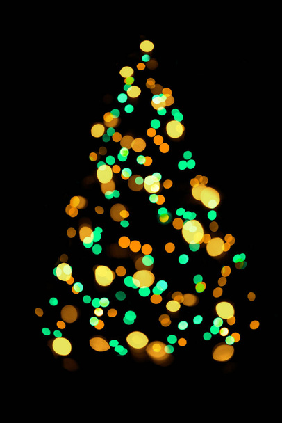Blurred christmas tree lights isolated on black background - Foto, Imagem