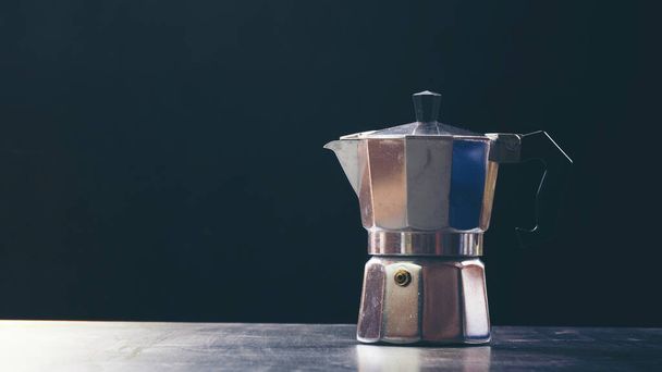 Mokapot coffee pot isolated on black background - Fotó, kép