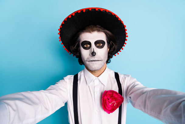Self-portrait of his he nice handsome spooky guy gentleman wearing sombrero blogger blogging social influencer zombie evening isolated bright vivid shine vibrant blue color background - Photo, image