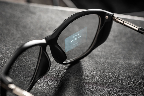 Music player app projected on a lens of smart glasses - Fotoğraf, Görsel