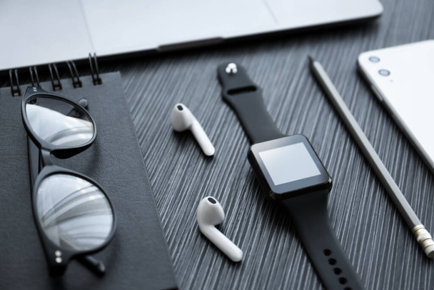 Composition with stylish smart watch on black table - Photo, Image