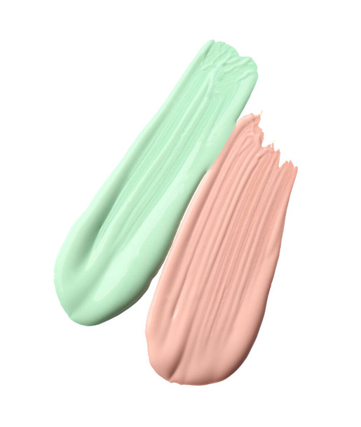 Strokes of different color correcting concealers isolated on white - Φωτογραφία, εικόνα