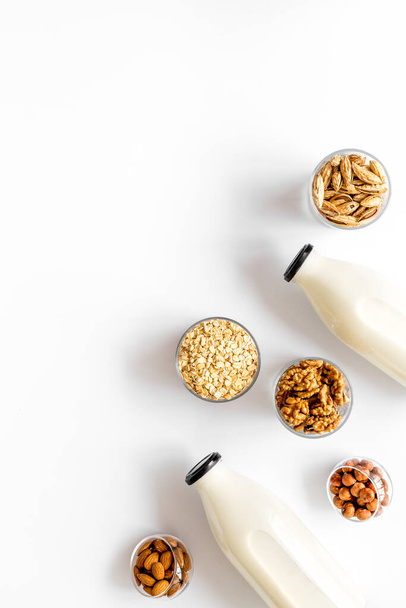 Bottles of non-dairy vegan milk - lactose free nuts and grain drink. Top view - Fotografie, Obrázek
