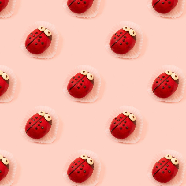 Children birthday party and holiday concept with Ladybug sweet yummy tasty colorful fancy cake seamless pattern against pink background.  - 写真・画像