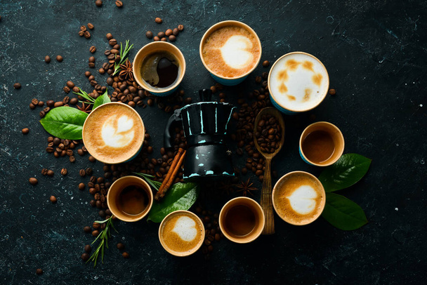 Set of coffee drinks: espresso, cappuccino, latte and Americano. On a black stone background. Top view. - Zdjęcie, obraz