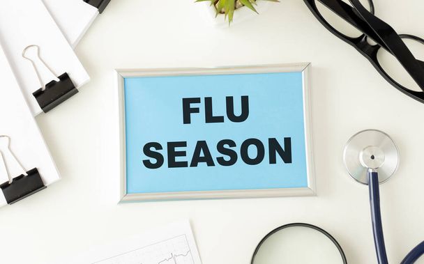 Flu Season written on a paper on table, top view - Φωτογραφία, εικόνα