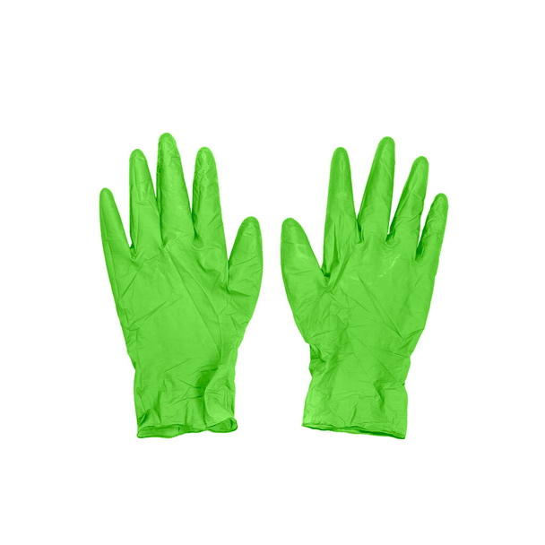 Зеленые хирургические медицинские одноразовые латексные перчатки изолированы на белом фоне. Вид сверху. - Фото, изображение