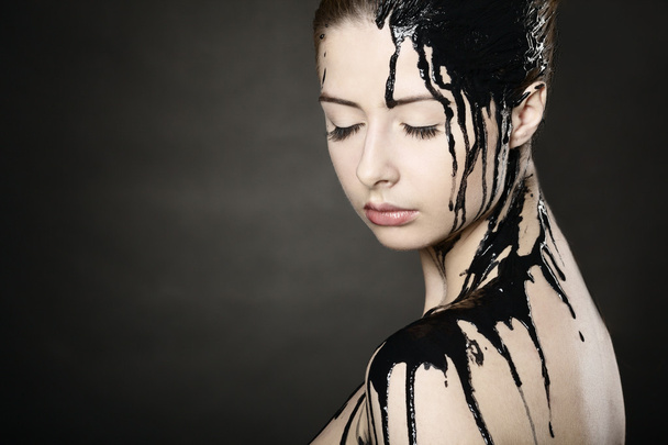 Beautiful girl with flowing down face paint - Foto, Imagem
