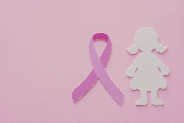 pink ribbon and woman on pastel background, Breast cancer awareness and October Pink day - Valokuva, kuva