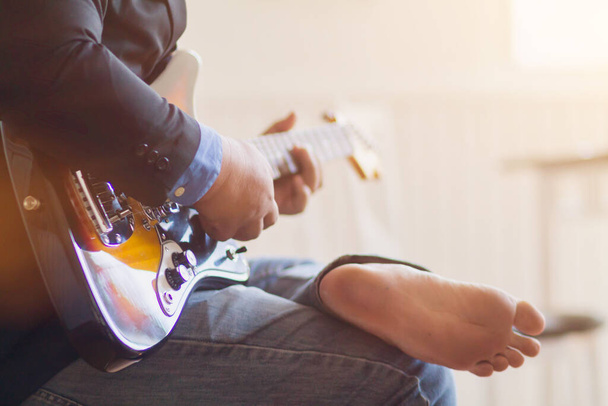Soft & Smooth Focus,Musicians are playing the guitar in a music practice room in a nightclub to prepare before performing the Guitar Classic during the evening. Professional guitar practice concept - Photo, Image