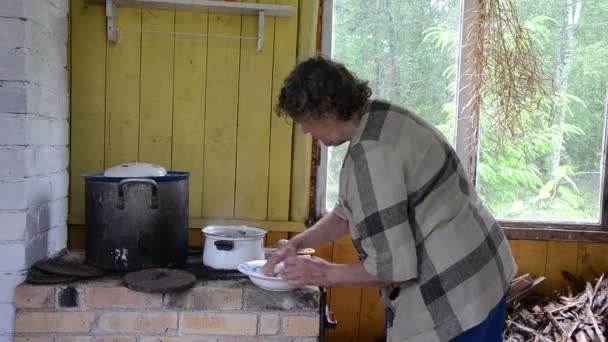 Rural furnace pot woman - Footage, Video