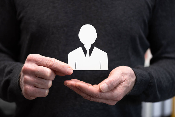 Man holding a paper employee; Concept of employee insurance - Foto, imagen