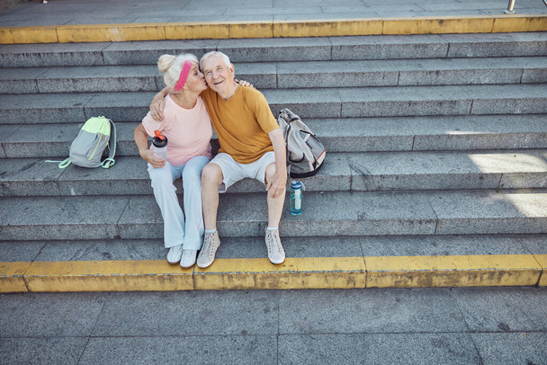 Loving aged spouses sitting on the stairs - Φωτογραφία, εικόνα
