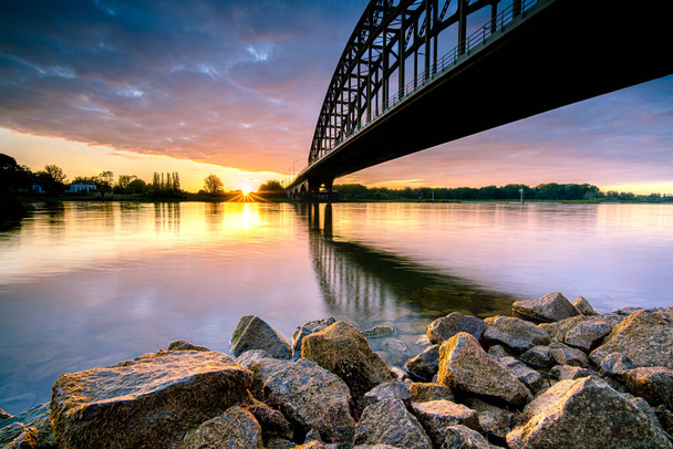Old 'IJssel brug' near the city of Zwolle in Overijssel, the Netherlands, Architectural feature at sunset - Foto, Imagen