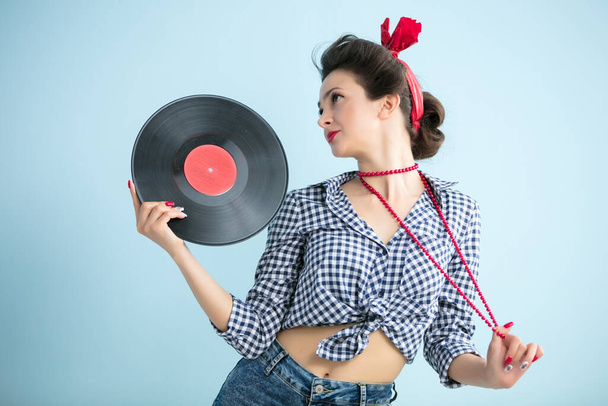 Retro woman with music record. - Photo, Image