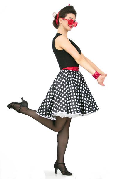 Retro girl in polka dot skirt - Фото, изображение