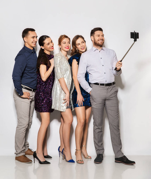 happy friends taking selfie by smartphone at party - 写真・画像