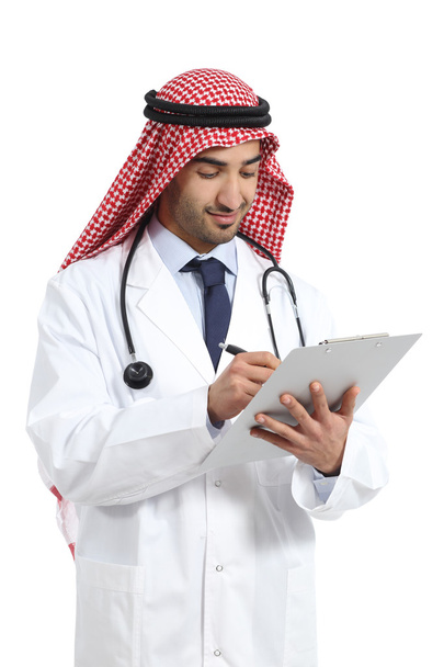 Arab saudi doctor man working writing in a clinical history - Φωτογραφία, εικόνα