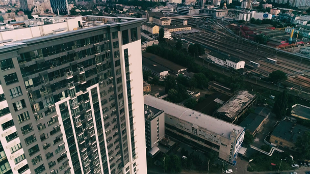 Aerial view of skyscraper in industrial district - Footage, Video
