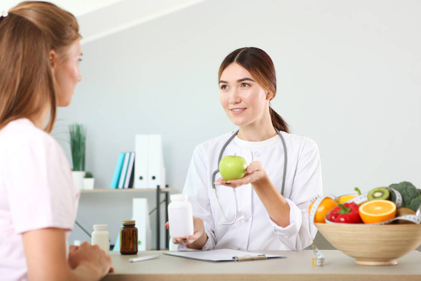 doctor nutritionist takes a patient in the office. proper nutrition, weight control - Photo, image