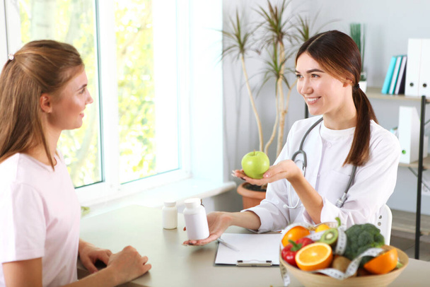 doctor nutritionist takes a patient in the office. proper nutrition, weight control - 写真・画像