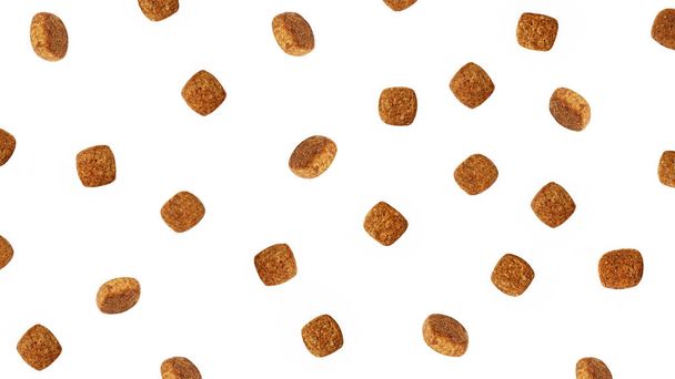 Dog food flying around poured in different directions on a white background. - Foto, Imagem