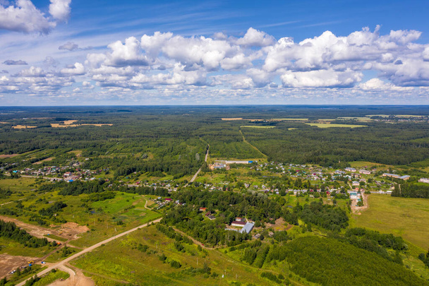 A view from a height to the village of Bunkovo, Ivanovo district, Ivanovo region, Russia. Photo taken from a drone.  - Foto, imagen