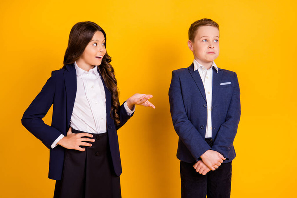 Portrait of his he her she nice attractive cheerful pre-teen schoolkids first meet date long-haired girl talking saying to modest guy isolated over bright vivid shine vibrant yellow color background - Foto, Bild