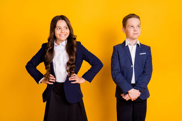 Portrait of his he her she nice attractive cheerful cheery pre-teen schoolkids first meet date modest guy long-haired girl isolated over bright vivid shine vibrant yellow color background - Fotó, kép