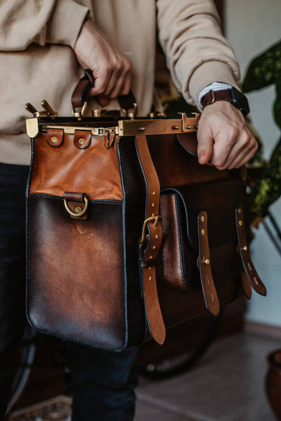 Business man holding elegant brown leather briefcase. - Zdjęcie, obraz