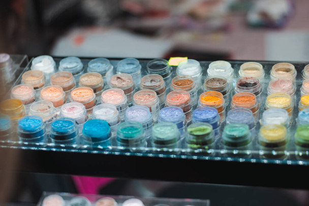 Mineral eyeshadow. Many jars with multi-colored eyeshadows. Exhibition of cosmetics - Photo, Image
