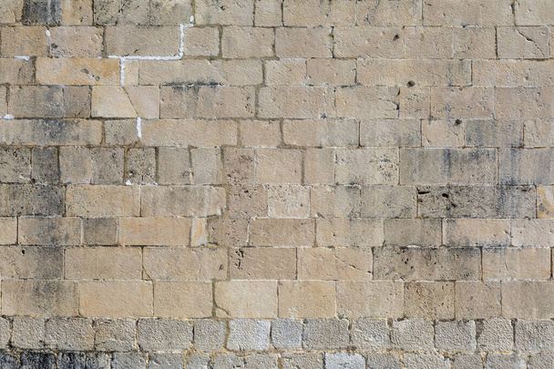 Antigua fachada de piedra de un histórico edificio costero mediterráneo. - Foto, imagen
