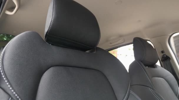luxury leather seats in car. beautiful leather car interior design. Black leather seat covers in the car. artificial leather rear seats in the car. Slow motion - Footage, Video
