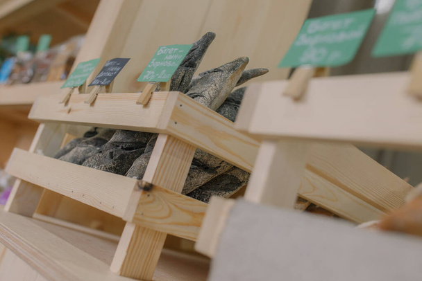 Fresh baked goods are beautifully arranged on display in wooden crates. - Valokuva, kuva